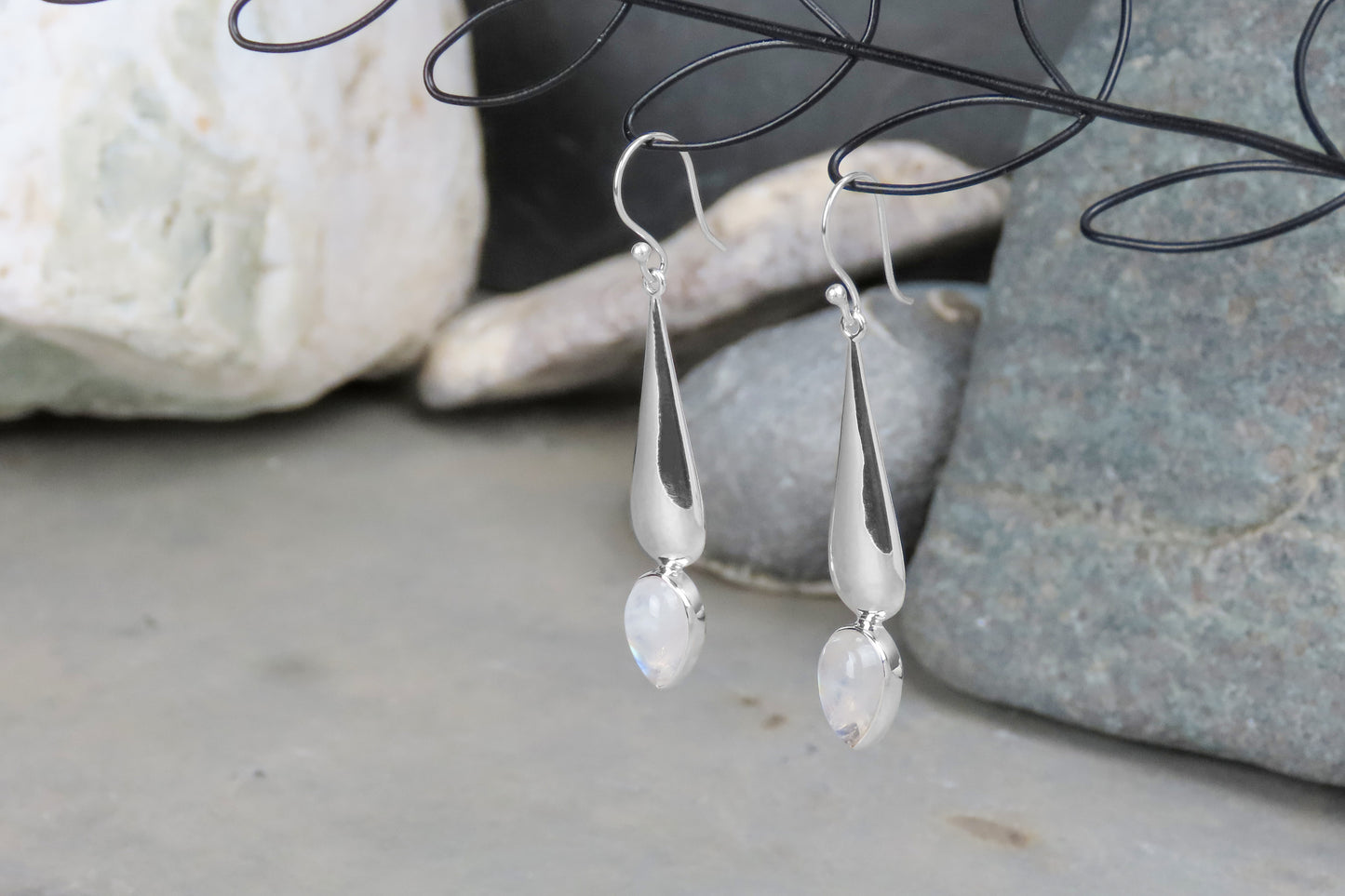 Long silver earrings rainbow moonstone gemstone iridescent stylish elegant design subtle individuality