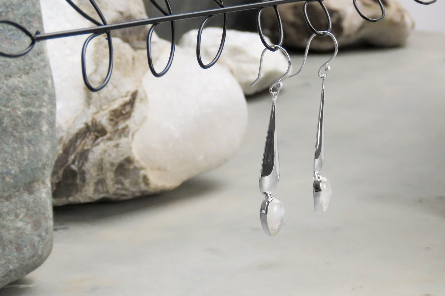 Long silver earrings rainbow moonstone gemstone iridescent stylish elegant design subtle individuality